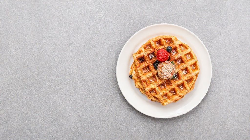 waffles in a white plate on grey background