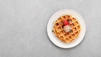 waffles in a white plate on grey background